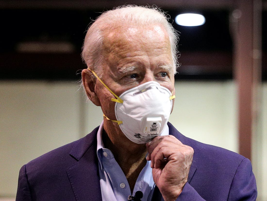 The new President Biden signs order requiring face masks on planes, buses, trains and at airports.